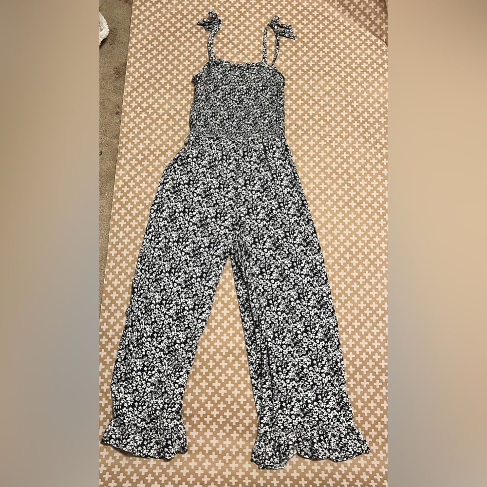 Art class navy blue floral print, tie around shoulder jumpsuit. Size 10/12